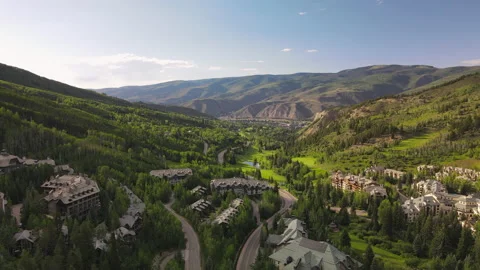 4K Aerial Drone moving forward over valley, village and road Stock-Footage 164678452