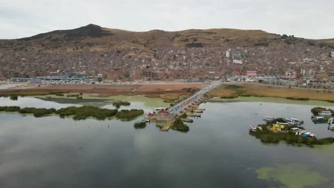 4K Aerial Drone Orbit Arc around Pier at Lake Titicaca in Puno, Peru in morning Stock Footage 239835381