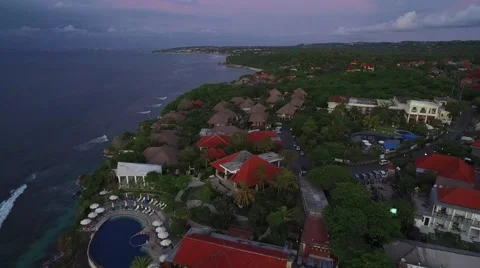 4K Aerial Drone Pull Back Reveal Shot of Single Fin Bar in Bali Indonesia Vídeo Stock 64164237