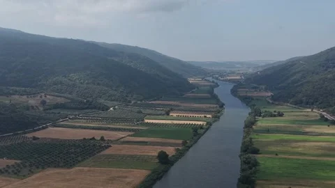 4K Aerial Drone  of River Valley, Green Farmland and Clouds Stock Footage 341529987