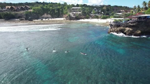 4k Aerial Drone shot of surfer in the ocean paddling surfing  Stockbeeldmateriaal 211917618