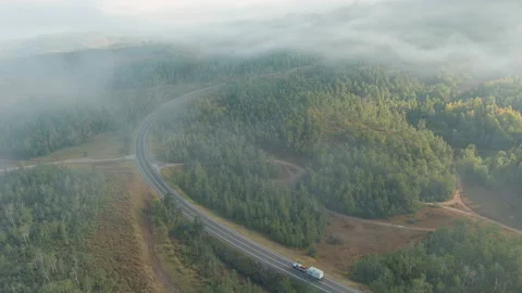 4K Aerial Drone Through The Clouds Revealing an RV 스톡 동영상 160691681