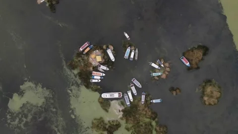 4K Aerial Drone Top Down Descent over boats on Lake Titicaca at Puno, Peru Stock Footage 239835376