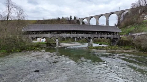 4k Aerial Drone under old Swiss Wooden Bridge Stock Footage 275935979