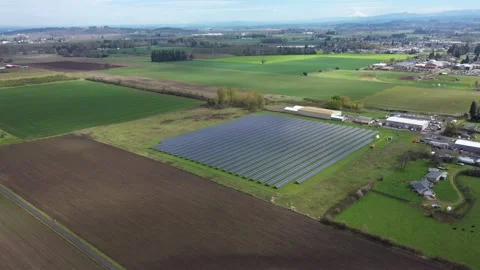 4K aerial drone view of a large solar panel farm in field in rural Oregon, USA  Video stock 332120689