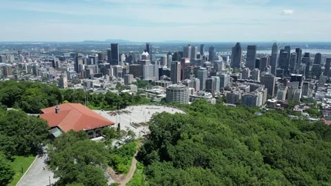 4K aerial drone view from Mount Royal overlooking Montreal skyline Stock Footage 332625984