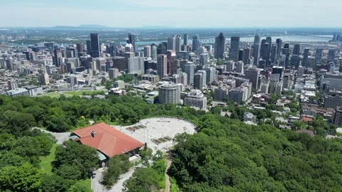 4K aerial drone view from Mount Royal overlooking Montreal skyline Stock Footage 332626039