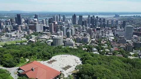 4K aerial drone view from Mount Royal overlooking Montreal skyline Stock Footage 332626067