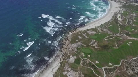 4K aerial drone view of Pebble Beach Golf course and shoreline Видео 64655683
