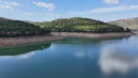 4K aerial drone view. Reflection of the cloud over the lake water. Stock Footage 286994367