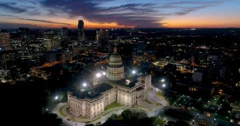 4K Aerial drone view of the Texas State Capitol grounds during sunset Stock Footage