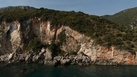 4k Aerial drone view video of rocky steep cliff white seascape Stock Footage 102000349