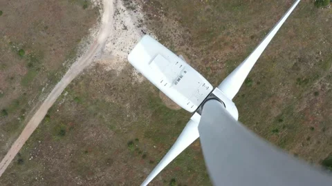 4K aerial drone view of a wind turbine. Close-up of the propeller from above. Stock Footage 132255741