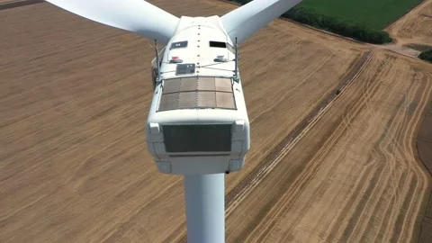4K aerial drone view of a wind turbine. Close-up of the propeller from above. Stock Footage 171364924
