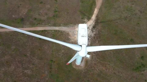 4K aerial drone view of a wind turbine. Close-up of the propeller from above. Stock Footage 176501580