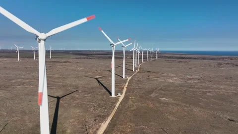 4K aerial drone view of a wind turbine.The drone passes through the propeller Stock Footage 176722601