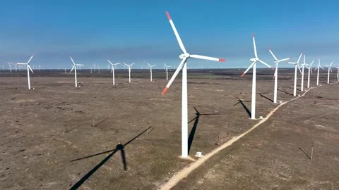 4K aerial drone view of a wind turbine.The drone passes through the propeller Stock Footage 178983424