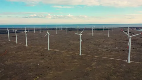 4K aerial drone view of a wind turbine. Windmill for electric power production Stock Footage 178985257
