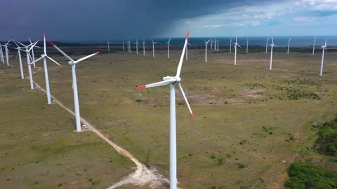 4K aerial drone view of a wind turbine.The drone passes through the propeller Stock Footage 263027577