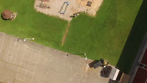 4K aerial of an elementary school playground and sports field in rural America Stock Footage 89505538