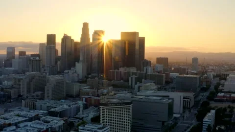 4K aerial of empty Downtown LA skyline silhouette at sunset during the Stock Footage 135619527