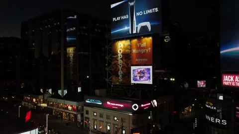 4K aerial flight Dundas Square flying towards billboard over Yonge Street at nig Stock Footage 149901433