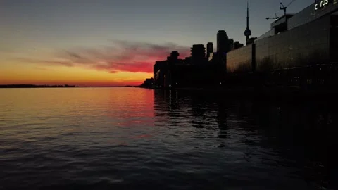 4K aerial flight low over Toronto harbourfront water with a beautiful reflection Stock Footage 149892257
