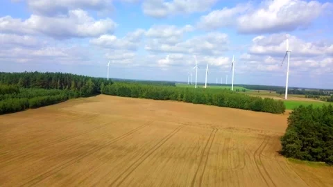 4k AERIAL with flight over fields, forest and wind turbines. Stock Footage 160245070