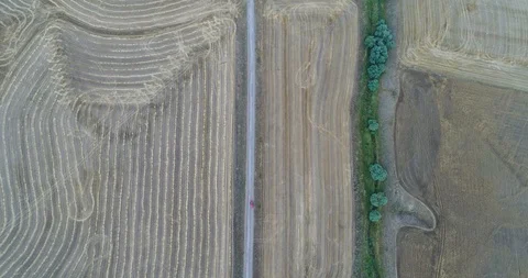 4K Aerial Flight Over Landscape Following Red Car On Rural Road Stock Footage 91709005
