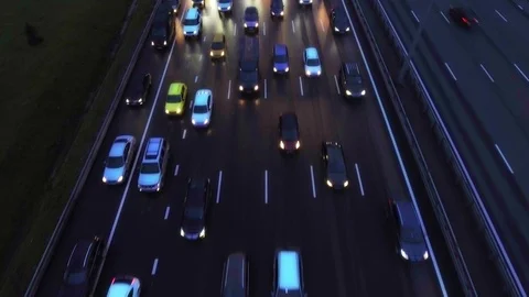 4K Aerial, flight over slow flow of cars in traffic jam on highway at night. 스톡 동영상 107370640
