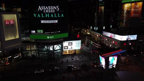 4K aerial flight rotating around Dundas Square looking at the electronic billboa Stock Footage 149901489