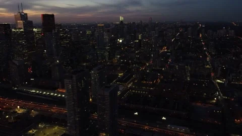 4K aerial flight through Toronto skyline at sunset with building all lit up Stock Footage 149892404