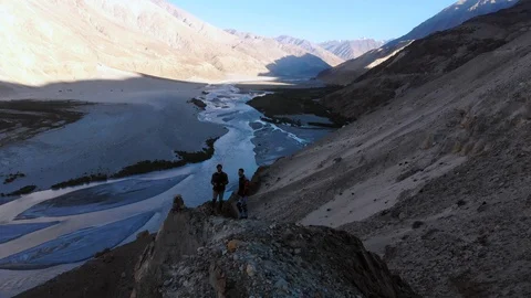 4k aerial fly over river system in dry mountain area in Ladakh in India Stock Footage 107615423