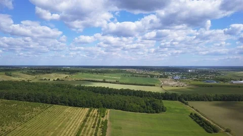 4K  Aerial.  Fly over spring  green fields, sky and clouds . Suburb landscape 스톡 동영상 90757597
