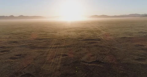 4K aerial fly over sunset view of the Koakoland savannah region of the Namib Stock Footage 95259595