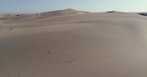 4K aerial fly over view of the barren landscape and sand dunes in the Namib Stock Footage 95286875