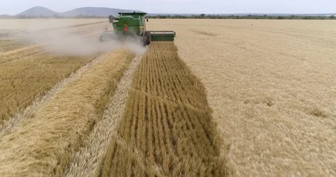 4K aerial fly over view of a combine har... | Stock Video | Pond5