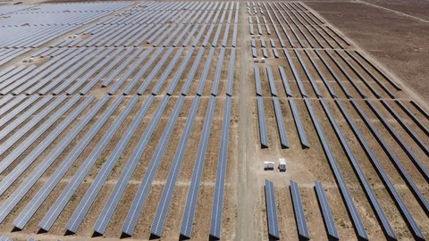 4K aerial fly over view of a large solar panel farm that produces renewable Video stock 104658485