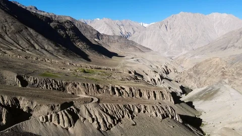 4k aerial fly through dry mountain valley in Ladakh in India Stock Footage 107614737
