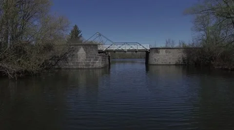 4k aerial fly under old stone bridge locks Stock Footage 63064312