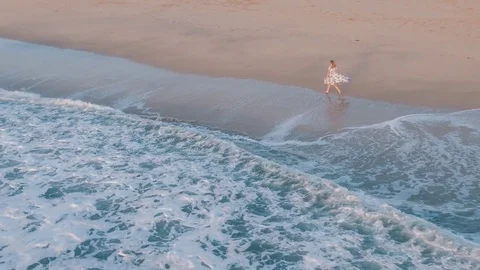 4k Aerial Flying Above Beautiful Woman Running On The Beach &amp; Ocean 스톡 동영상 80986935