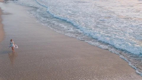 4k Aerial Flying Above Beautiful Woman Running On The Beach &amp; Ocean Stock Footage 80989596