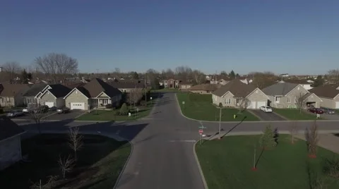 4k aerial flying down wealthy community street Stock Footage 63078039
