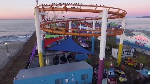 4K AERIAL FOOTAGE OF DRONE flying over the Santa Monica Pier at Sunrise Stock Footage