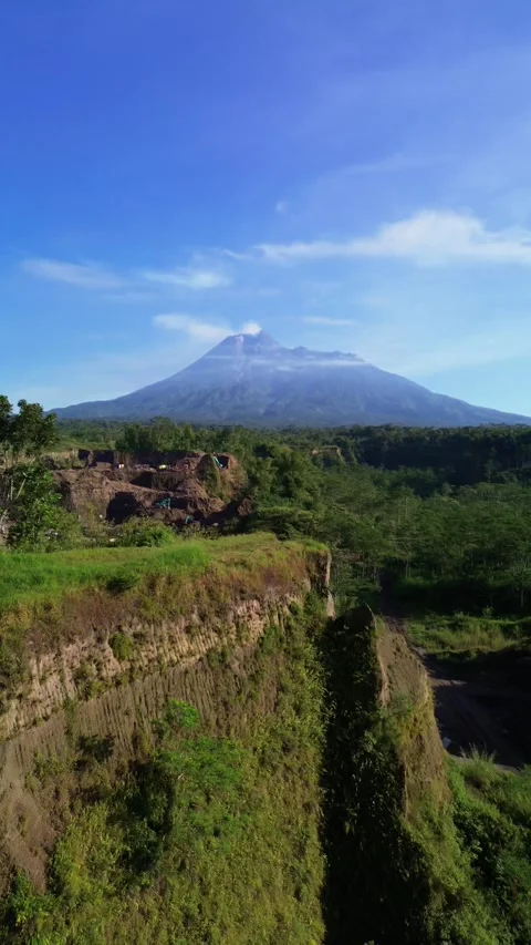 4K aerial footage of Mount Merapi with eroded cliffs and ravines Stock Footage 336699614