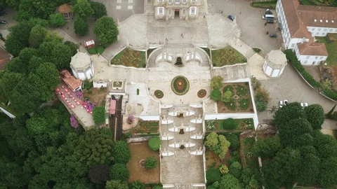 4k Aerial footage pulling back while tilting up revealing Bom Jesus do Monte Stock Footage