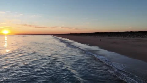 4K Aerial: Forward drone flight over Atlantic Ocean at sunset in Huelva Spain. Stock Footage 333637605