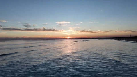 4K Aerial: Forward flight towards sunset reflection on Atlantic Ocean Spain. Stock Footage 333637657