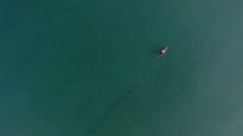 4K Aerial Kayaking over deep blue sea Stock Footage 128942872