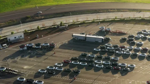 4K aerial of loading dock at parking lot electric vehicles factory, eco-friendly 스톡 동영상 167102771